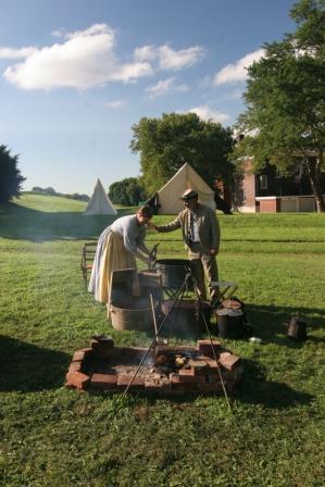 Civil War era living historians prepare for a meal on Governors Island. Image by Daniel C. Krebs, courtesy of the NPS.
